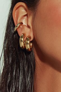 The pair to swear by. Sleek and sculptural - even in its lobe-hugging minutiae. Our gold-filled tube huggies are the most versatile earring you’ll ever own. Stack with hoops, cuffs or studs, wear just as accent pieces, or double up with our sterling silver version for a modern touch of tonal duality. Jewelry Collection Handcrafted in Brazil 18k Gold Filled Thickness: 7mm Diameter: 1" Weight: 0.20 oz Waterproof Hypoallergenic Gold Earrings Aesthetic, Hoco Jewelry, Gold Statement Jewelry, Sculptural Jewelry, Stacked Earrings, Chunky Earrings, Gold Ear Cuff, Dope Jewelry, Fall Earrings