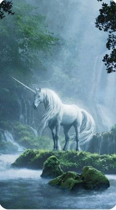 a white unicorn standing on top of a lush green forest next to a waterfall in the woods