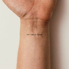 a person's arm with the words your time is limited written on its wrist