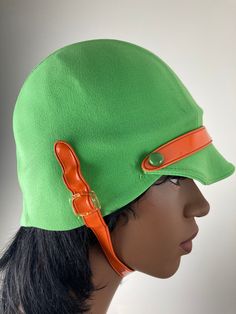 Fabulous pea green helmet swim cap with orange chin and visor strap. Great mod styling for a great Carnaby Street/That Girl look.  Outside fabric feels to be a stretch nylon, which is bonded to an inner latex/rubber/plastic layer (not sure which). Cap is in very good to excellent condition, with some cracking in the underlayer and a small pull or on the outside. Retro Green Bucket Hat, Green Retro Bucket Hat, Fitted Retro Green Hat, Retro Fitted Green Hat, Green Fitted Retro Hat, Retro Green Brimmed Hat, That Girl, Cap Outfit, Louis Feraud