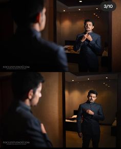 the man is adjusting his tie while standing in front of a mirror and looking at himself