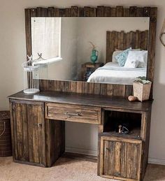 a bedroom with a bed, dresser and mirror