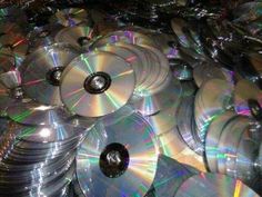 many cds are stacked on top of each other