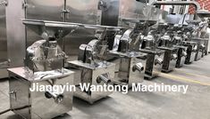 several machines are lined up in a large room with the words jasgynn wanting machinery