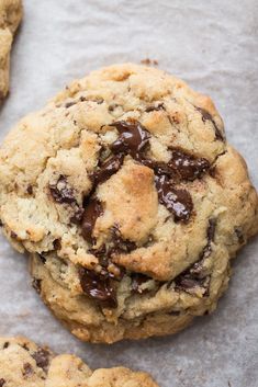 chocolate chip cookies with text overlay that reads levin copycat giant dark chocolate chunk cookies