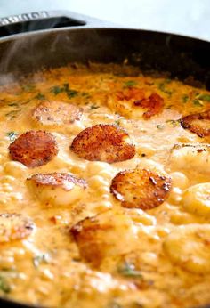 some food is cooking in a pan on the stove