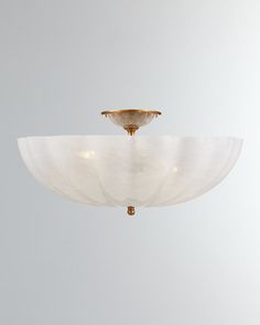 a white ceiling light hanging from the ceiling