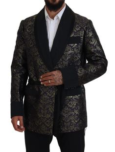 Immerse yourself in the opulent elegance of this stunning robe jacket by Dolce & Gabbana. Tailored to perfection, this piece combines luxurious fabrics with exquisite design, making it a must-have for fashion connoisseurs. It features an intricate gold jacquard pattern against a deep black hue, complemented by a sophisticated waist belt closure and a sleek black silk lining for ultimate comfort. Crafted in Italy, this blazer is a testament to the brand’s commitment to premium quality and style. Model Blazer, Mens Blazer Jacket, Wrap Jacket, Jacquard Pattern, Dolce E Gabbana, Dolce And Gabbana Man, Jacket Blazer, Blazers For Men, Guess Jeans