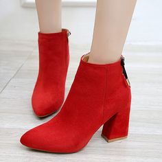 woman's red high heeled boots with zippers on the front and side