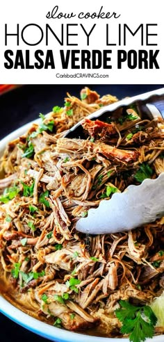 shredded pork in a white bowl with cilantro garnish on the side