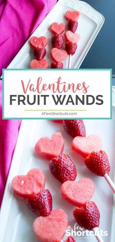 valentine's fruit wands on a plate with strawberries in the shape of hearts