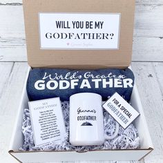 a gift box with coffee mugs, socks and other personalized items in it