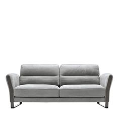 a gray couch sitting on top of a white floor