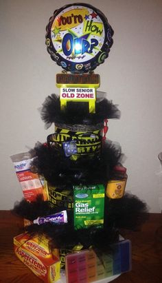 a stack of candy and candies on top of each other in front of a wall