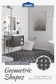 a white bathroom with black and white porcelain flooring that has geometric shapes on it