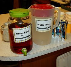 there are two jars with labels on them sitting on the counter next to each other