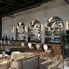 the interior of a restaurant with tables, chairs and stools in front of three circular windows