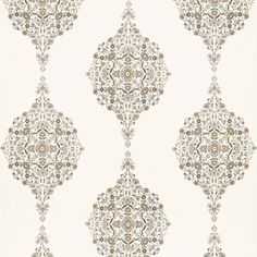 a white and brown wallpaper with an ornate design