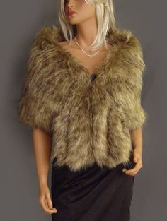 a mannequin wearing a fur jacket and skirt