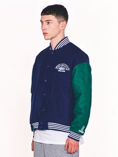 Editor's Notes Featuring various embroidered logo graphics, this casual varsity jacket is made from wool-blend with lightly padded lining for warmth. It's constructed with classic color-blocking body and sleeves with sporty striped ribbed edges.- Snap button fastenings- Two front welt pockets- Logo embroidery on the chest, sleeve and back- Logo labels on the hem and back- Striped ribbed edges- Drop shoulder- Relaxed fitMeasurements (in.) 2 / 3- Total Length: 26.0 in. / 27.2 in. - Shoulder: 22.8 in. / 24.4 in.- Chest: 25.2 in. / 26.8 in.- Sleeve Length: 22.8 in. / 23.6 in.Model info: 5' 11.7, 132.3 lbs / Fitting size 3Composition & Care- Shell: 50% Acrylic, 50% Wool- Lining: 100% Polyester- Filling: 100% Polyester- Dry clean only- Refer to the care labelDesigner- by FREAKISH BUILDING Cotton Varsity Jacket With Letter Patch And Baseball Collar, Green Varsity Outerwear With Baseball Collar, Winter Cotton Varsity Jacket With Patchwork, College Style Cotton Outerwear With Baseball Collar, Cotton College Style Outerwear With Baseball Collar, Winter Varsity Jacket With Patchwork And Baseball Collar, Cotton Varsity Outerwear With Patchwork, Winter Varsity Jacket With Patchwork, Varsity Long Sleeve Outerwear For Campus