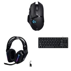 a computer keyboard, mouse and headphones on a white background