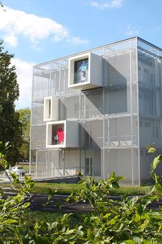 an apartment building with several balconies on the side