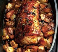 meat and potatoes in a pan on the stove