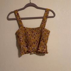 American Eagle Smocked Tank Size Small Non Adjustable Straps Lowballs Trades Casual Smocked Top With Smocked Back For Vacation, Casual Cotton Smocked Top With Floral Print, Casual Smocked Top With Floral Print For Beach, Casual Floral Print Smocked Top For Beach, Casual Cropped Smocked Top, Casual Floral Smocked Top For Beach, Casual Yellow Smocked Top With Ruffles, Casual Yellow Tops With Smocked Back, Casual Cropped Smocked Top For Day Out