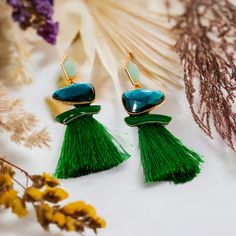 These exquisite green earrings are a luxurious addition to any outfit. The design features a stunning green faux diamond complemented by subtle gold covers, creating a beautiful contrast. Perfect for any occasion, these earrings can elevate a dress or blazer to new heights of elegance. Length: 3.5 inches Care: Avoid contact with water and cosmetics, such as creams or perfumes. Coffee And Espresso Maker, Gem Earrings, Lip Hair, Sustainable Fashion Brands, Toy Organization, Green Earrings, Sweater Set, A Dress, Free Giveaway