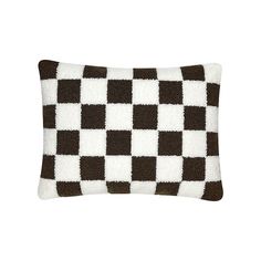 a brown and white checkered pillow on a white background