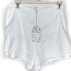 Honey Belle White Shorts With Embroidered Design. Lined With High-Rise Style. White Shorts Size Medium. Features Side Zipper. Approx. Measurement: 14” Waist. 100% Viscous/ Lining: 100% Cotton. Sgg0047 High Waist Embroidered Cotton Bottoms, Fitted Beach Bottoms With Floral Embroidery, High-waist Embroidered Cotton Bottoms, Summer Cotton Shorts With Floral Embroidery, White Cotton Shorts With Floral Embroidery, Floral Embroidered Cotton Summer Shorts, White High Waist Cotton Pajama Shorts, White High-waist Cotton Pajama Shorts, High Waist White Cotton Pajama Shorts