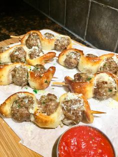 meatball kabobs on skewers with marinara sauce