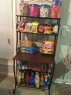 a shelf filled with lots of food next to a door