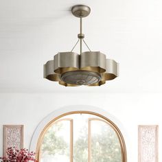 a dining room table and chairs with a round window in the background