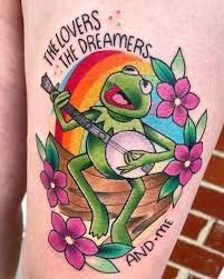 a person with a frog tattoo on their leg