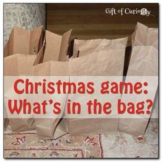 some brown paper bags sitting on top of a rug with the words christmas game what's in the bag?