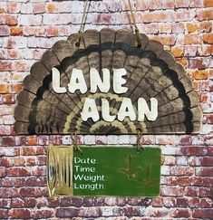 a sign that is on the side of a brick wall saying lane aln date time weight length