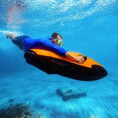 a man floating on an inflatable boat under water