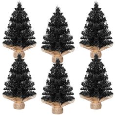 four black christmas trees with burlocks on them