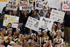 the cheerleaders are posing for a photo with their signs in front of them