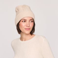 Crafted with a chunky cable knit, this Cable Hat is both stylish and functional. Its matching set design ensures a coordinated look, while the foldover cuff adds versatility. Stay warm and cozy with this must-have winter accessory. Pair with the Cable Scarf and the Cable Hat for the full look. Hat Novelty Cable knit detailing on head Ribbed fold over cuff 8 1/2" length 100% Cashmere 70095212A Cable Scarf, Cable Hat, Chunky Cable Knit, Full Look, Winter Accessories, Set Design, Matching Sets, Stay Warm, Warm And Cozy