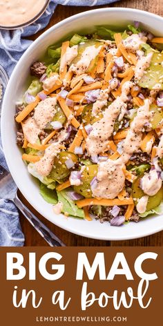 a big mac in a bowl with lettuce, cheese and other toppings