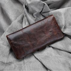 Product information: Product Name：Wallet Material: genuine leather Lining texture: genuine leather Opening mode: draw belt Internal structure of the bag: concealed compartment, large bill holder, photo position, change position, bankbook position, zipper compartment, ID position, card position, key position, check position Style: urban minimalist Applicable scenes: Daily with Color: brown Product size: length 19cm width 9cm thickness 2cm Packing list: Wallet x1 Leather Bifold Wallets With Cell Phone Pocket, Leather Bifold Wallet With Cell Phone Pocket, Business Leather Card Holder With Cell Phone Pocket, Classic Leather Trifold Wallet With Cell Phone Pocket, Leather Wallets With Card Slots For Business, Classic Leather Wallets With Cell Phone Pocket, Classic Leather Wallet With Cell Phone Pocket, Formal Leather Wallet With Cell Phone Pocket, Brown Leather Card Holder With Cell Phone Pocket