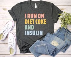 I run on diet coke and insulin Shirt - Unisex T Shirt, Long Sleeve T-Shirt Tees Tshirt Sweatshirt Sweater Hoodie Gift For Men Women Boys Girls Well, let's say goodbye to all this boring apparel... The GodBlessThisDesign team creates custom clothes with great designs to suit all tastes. Our unique and blessed designs are a blast fit for every occasion and always a perfect fit... We combine our beautiful designs with high quality apparel like no one has ever done before. There's nothing worse than being charmed by a nice design and then finding that the apparel with that design looks like an old cheap and mediocre quality apparel. All right, then ... we got you covered. You are absolutely going to love our dynamic duo of comfortable AND cute apparel. A B O U T - T H I S - A P P A R E L Avail Maternity Tees, Reading Shirts, Book Shirts, Collars For Women, Nursing Shirts, Patterned Shorts, Teacher Shirts, Mom Shirts, Unisex Shirt