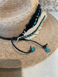 If you love leather and turquoise, this one is for you. Have fun wearing this adjustable leather and cowhide feather hatband with faux turquoise nuggets. Bohemian Concho Hat Bands Adjustable, Bohemian Adjustable Concho Hat Bands, Adjustable Bohemian Concho Hat Bands, Adjustable Leather Hat Bands In Bohemian Style, Adjustable Leather Bohemian Hat Bands, Bohemian Adjustable Hat Band With Feathers, Adjustable Bohemian Leather Hat Bands, Adjustable Feather Hat Bands For Festivals, Adjustable Hat Bands With Feathers For Festivals