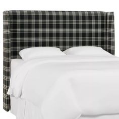 a black and white plaid headboard on a bed