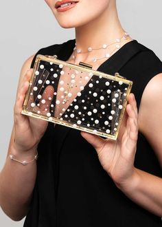 Be the life of the party with the NINA clutch! This stylish lucite box clutch purse offers unique flair with a silver metal frame that is embellished with Austrian crystals and pearls that are placed in a polka dot pattern that won't go unnoticed. Show off some sass and store all your necessities in this fun, one-of-a-kind clutch! The purse is embellished with scattered gold Austrian crystals and off-white Austrian pearls. White Modern Clutch For Parties, Modern White Clutch For Parties, Phone Items, Box Clutch, Life Of The Party, Polka Dot Pattern, Free Gift Wrapping, Austrian Crystal, Luxury Accessories