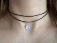 Gemstone choker necklace made of cotton with a natural moonstone drop pendant of very high quality in gold or silver. In short 🧘 Care, mindfulness and positive energy during production (handmade) 💎 Real, natural crystals of very high quality & without manipulated colors ⟐ Pendant wire material: 14k gold filled or 100% 925 Sterling Silver (Waterproof) ⟐ Smooth waxed cotton strap ⟐ Necklace can be easily adjusted using sliding knots 🍃 Environmentally friendly materials, production, packaging and shipping 🧘 Carefully and lovingly handmade 🧘 All gemstones are cleansed and charged with selenite from previous energies. We only work on your necklace with positive and loving intentions so that we can hand it over to you with the same energies. A lot of love and effort goes into each individua Gemstone Choker Necklace, Rainbow Moonstone Necklace, Gemstone Choker, Moonstone Necklace, Moonstone Jewelry, Moonstone Pendant, Drop Pendant, Matching Bracelets, Rainbow Moonstone