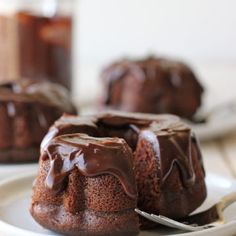 chocolate bundt cakes on a plate with spoons