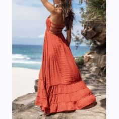 Flowy Maxi Backless Summer Beach Vacation Dress Red Size S Red Sundress For Beach Cover-up, Orange Halter Neck Dress For Beach Party, Chic Red Dress For Beach Party, Red Sleeveless Sundress Beach Dress, Strapless Maxi Dress For Beach, Beachy Maxi Dress For Summer Parties, Strapless Beach Dress For Beach Season, Chic Orange Sundress For Beach Season, Red Summer Dress For Beach Party